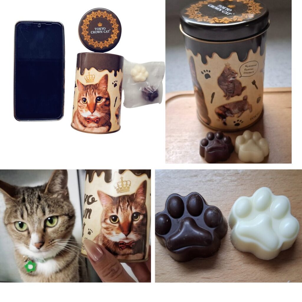 缶は携帯より一回り小さい。可愛い肉球形ブラックとホワイトチョコ。キジトラキャラが可愛い茶系の猫缶。